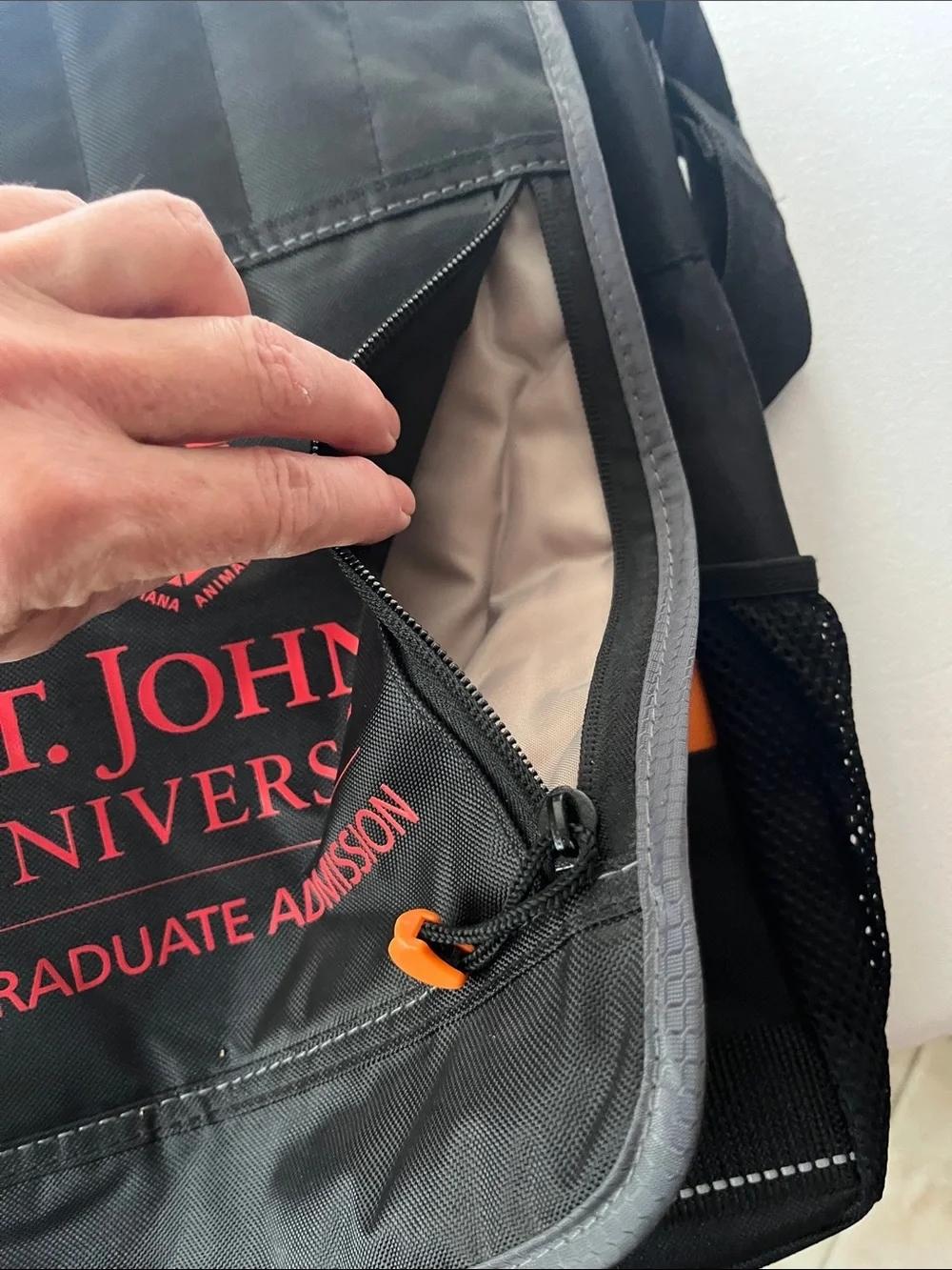 UNISEX St. John’s University Black Messenger Bag with Red Logo